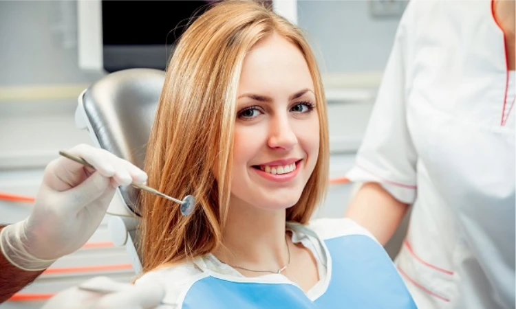 Smiling woman showcasing the benefits of dental veneers for a perfect smile